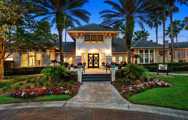 A beautiful house with a front yard and a driveway.