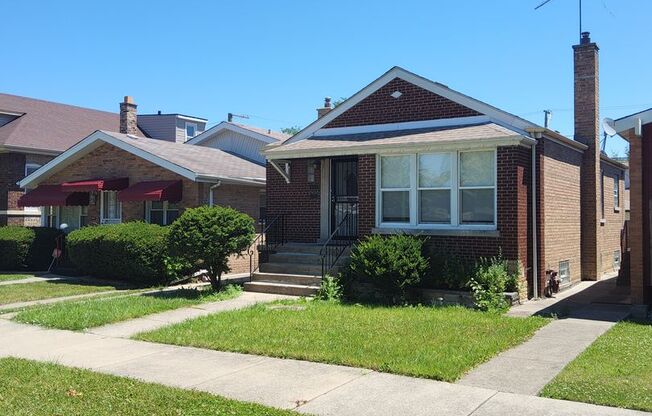 Stunning 4 bed, 2 bath raised brick ranch home with a finished basement, located on a serene block in a desirable neighborhood.