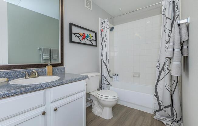 a room with a sink and a mirror