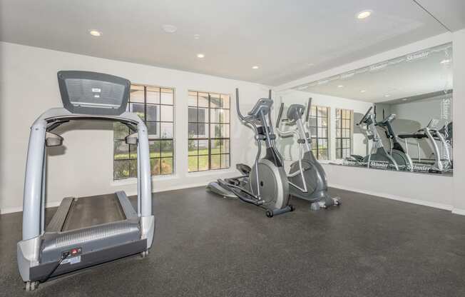 the gym at the enclave at woodbridge apartments in sugar land, tx