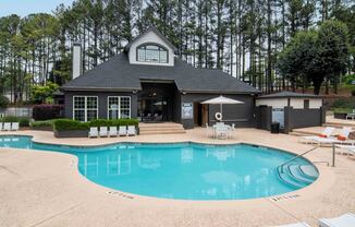 a swimming pool in front of a house