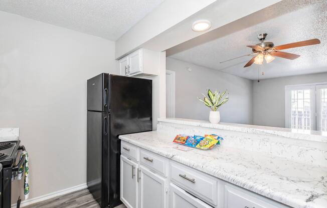 a kitchen with a sink and a mirror