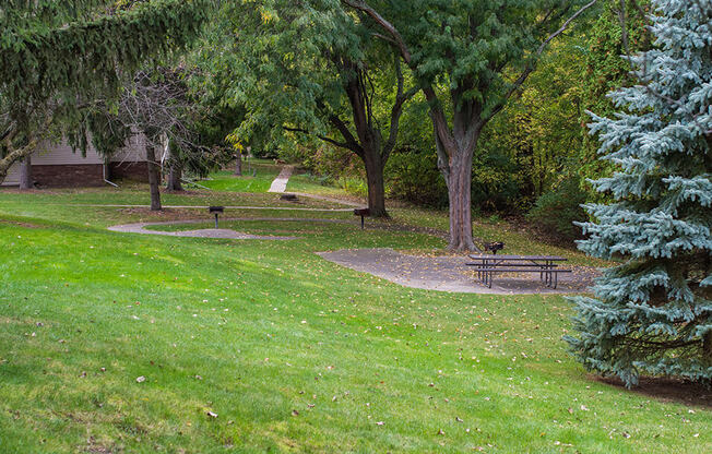 a park with a picnic table and trees