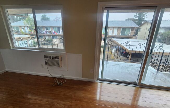 Second Floor Unit -Laminate Floors Throughout- Wall AC in Living Room