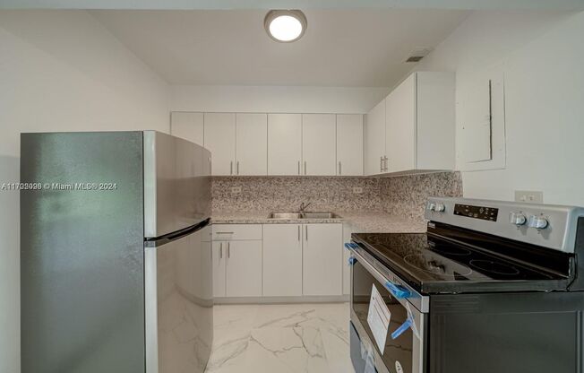 This two-bedroom, one-bath unit is ideally located in the heart of Miami, offering convenient access to i95. It features a laundry room and a generous backyard, and is well-maintained, making it a great living option for those seeking comfort and space. T