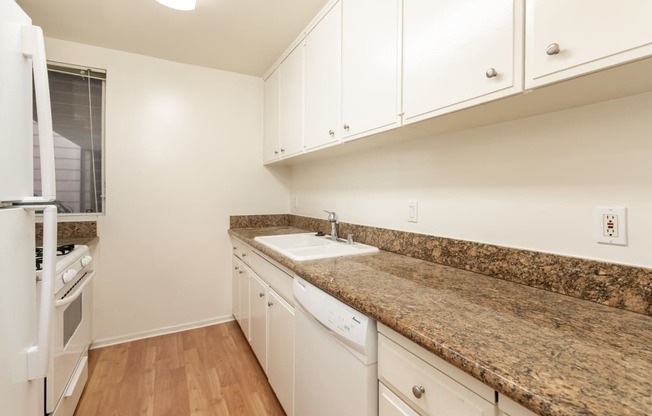 Kitchen with White Appliances and White Cabinets