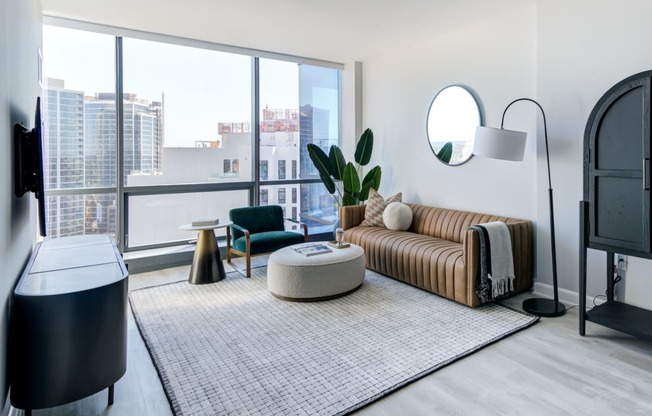 a living room with a couch and a large window