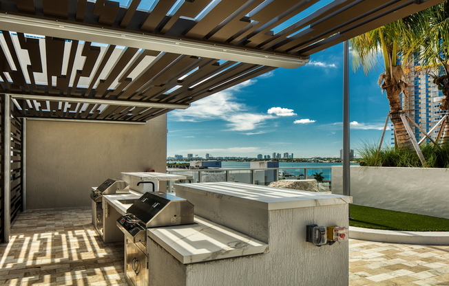 Rooftop outdoor kitchen and barbeque area with views of Biscayne Bay