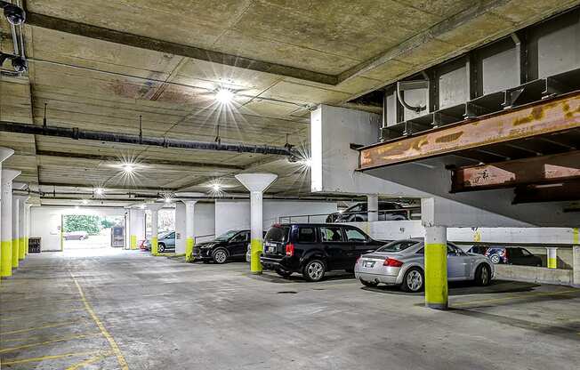 A parking garage with cars parked in it.