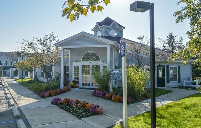 Exterior of the Green Meadows Clubhouse with Manicured Landscaping