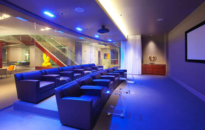 Theater and viewing room with purple lighting  at 1600 Glenarm Place, Colorado