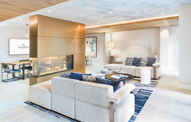 Lounge in style at Modera Liberty Row, where elegant design and cozy fireplace seating create the perfect Charlotte retreat.