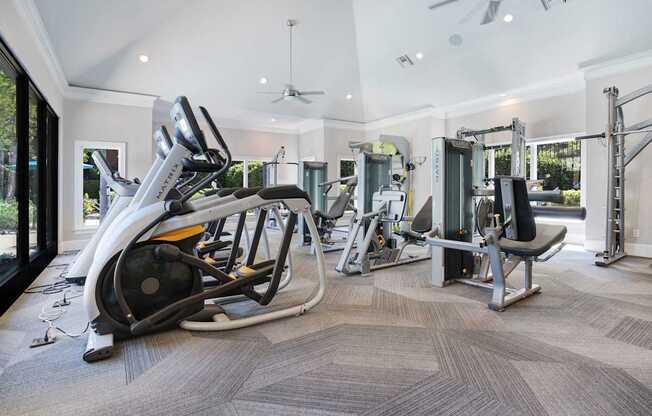 A spacious home gym with a variety of equipment.