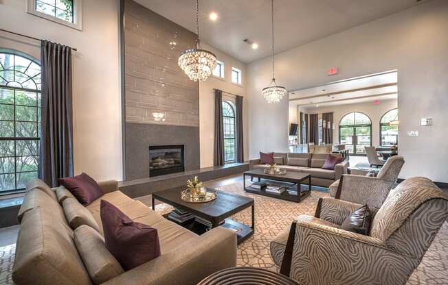 A living room with a fireplace and a chandelier.