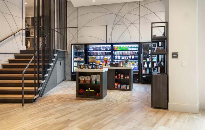 the lobby of a store with a vending machine and stairs