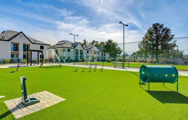 a playground at the enclave at woodbridge apartments in sugar land, tx