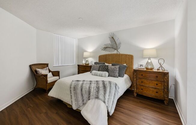 a bedroom with a bed and a dresser