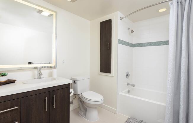 a bathroom with a toilet sink and bathtub