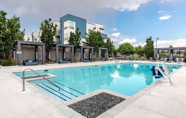 a swimming pool with a building in the background