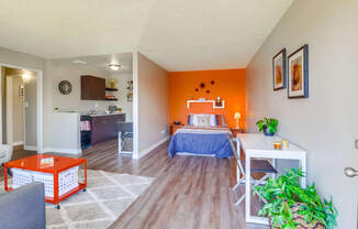 Las Brisas Apartments in Colton, CA with hardwood flooring, stylish decor, and access to living room
