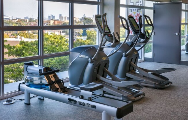 Fitness center with equipment at a rental community in Miami.