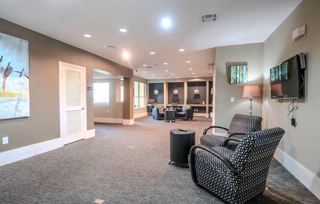 an empty living room with couches and a tv