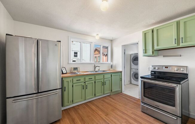 1/2 Month Free! Storybook Farmhouse - Updated Kitchen, A/C, Basement, Fenced Yard, Garage, Laundry, and More!