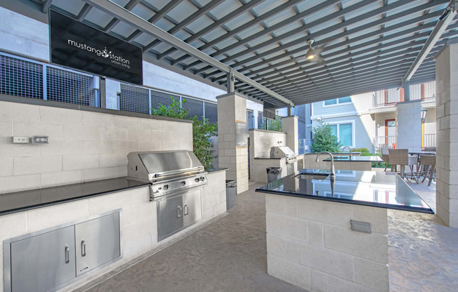 Outdoor kitchen with grill and sink