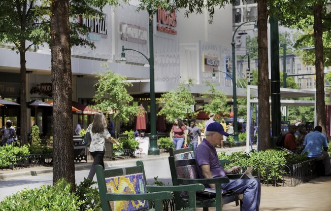 Man Sitting In A Park at Metro 710, Silver Spring