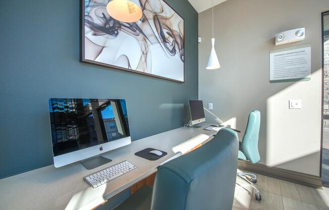 a desk with a computer in a room