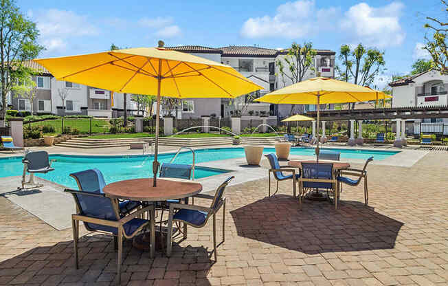 Community Swimming Pool with Pool Furniture at Reserve at Rancho Apartments located in Moreno Valley, CA.