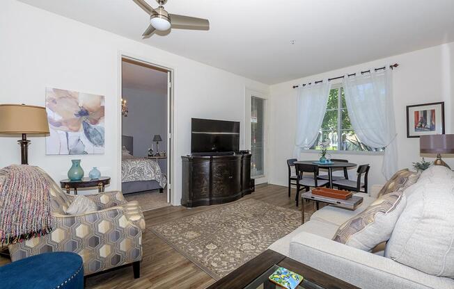 a living room filled with furniture and a flat screen tv