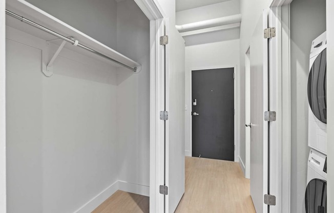 A laundry room with a washer and dryer. at Brickside Heights, Millcreek, UT