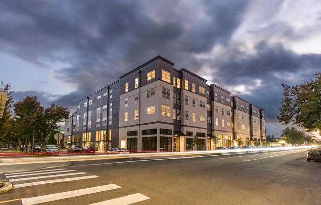 Modera Woodstock shines at twilight, showcasing modern design and inviting homes.