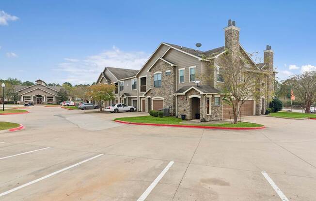 A large house with a driveway in front of it.