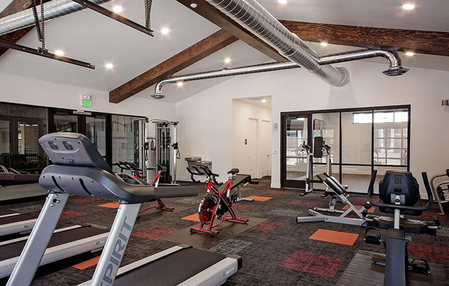 24 hour fitness center with cardio equipment and weights