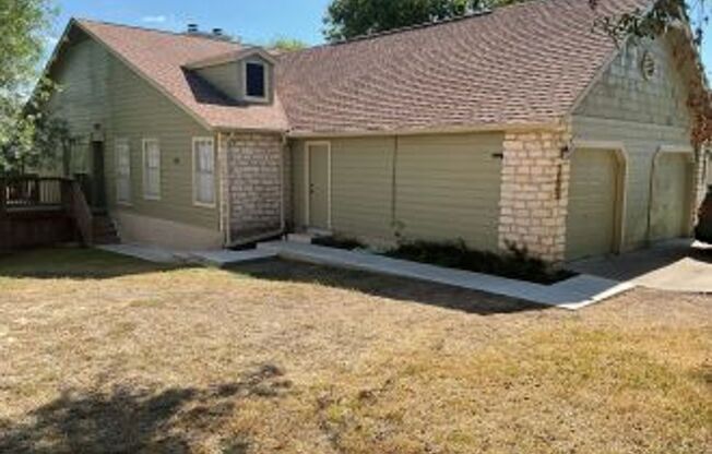 This incredible three bedroom home is minutes away from Lake Travis