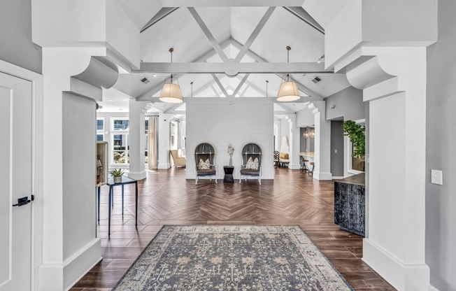 a large living room with a fireplace and a rug