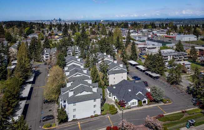 A suburban area with a mix of residential and commercial buildings.