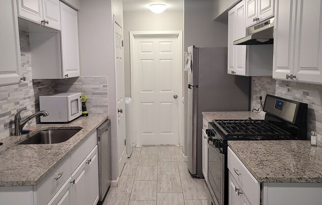 DOVE SPRINGS DELIGHT - RENOVATED  2/2 DUPLEX - HUGE YARD - GARAGE