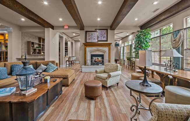 club house with couches and chairs and a fireplace