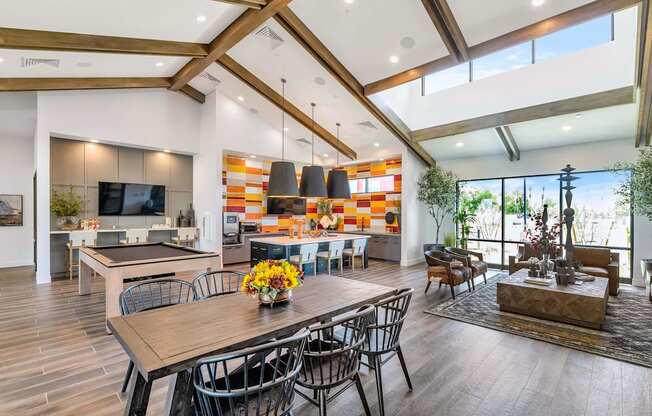 a living room with a dining room table and a kitchenat Weylyn Luxury Apartments, Laveen, AZ 85339