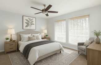 A bedroom with a large bed, a ceiling fan, and a chair.