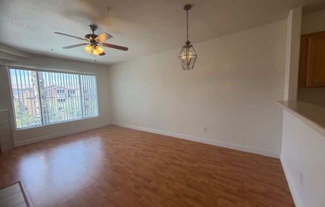 GUARD GATED TOP FLOOR PRIVATE 1 BED CONDO FEATURING A DETACHED 1 CAR GARAGE