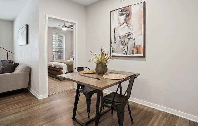 an open living room and dining room with a table and chairs