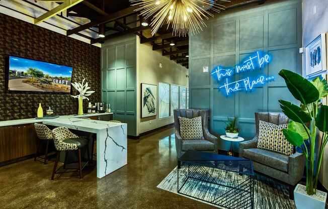 A room with a neon sign that says