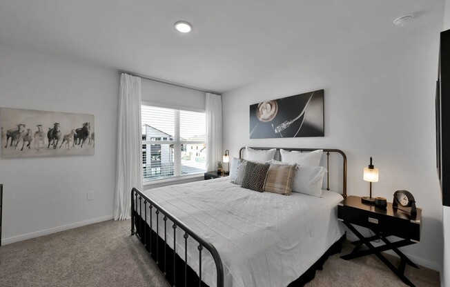 Enjoy luxury living at Esperanza at Wild Orchid. This beautifully designed bedroom features modern décor, abundant natural light, and a cozy atmosphere. Elevate your lifestyle and schedule a tour today to see your new home!