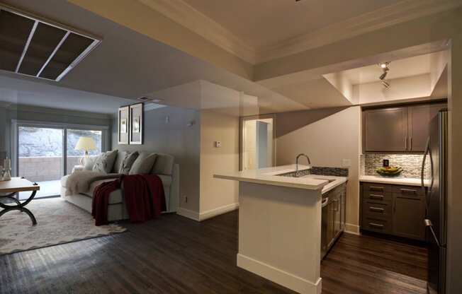 a living room with a kitchen and a couch