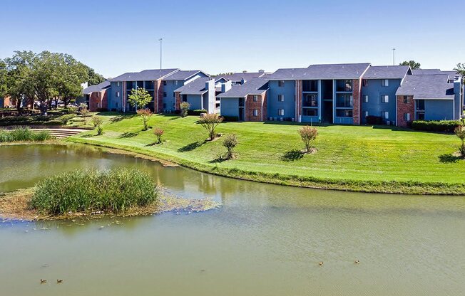 an apartment building next to a body of water