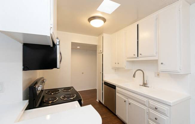 Kitchen with Stainless Steel Appliances and White Cabinets